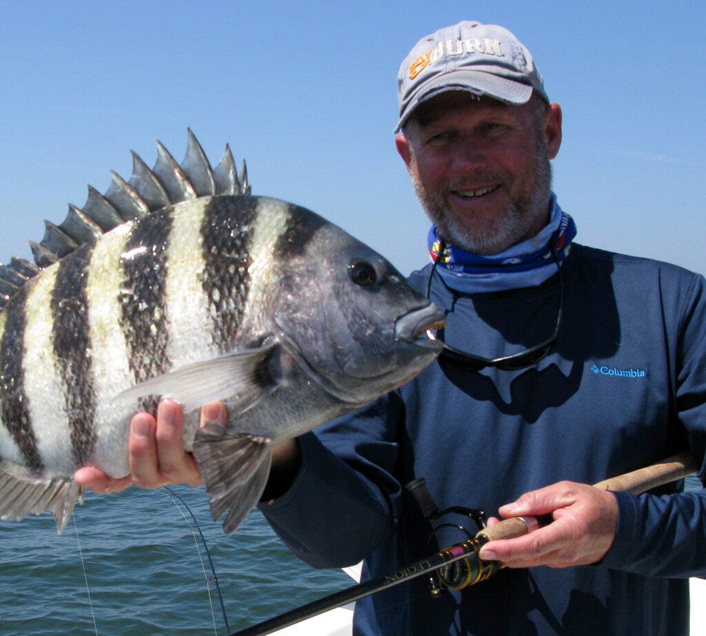 Capt. Greg Hildreth holding a big sheepshead
