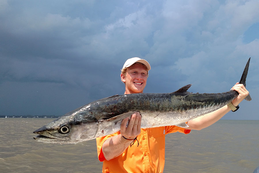 Angler holding a cobia on a Georgia fishing charter