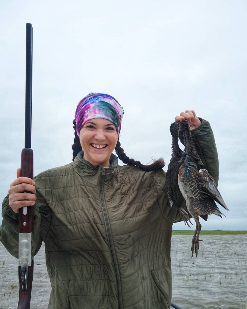 Hunter holding marsh hens after a hunt