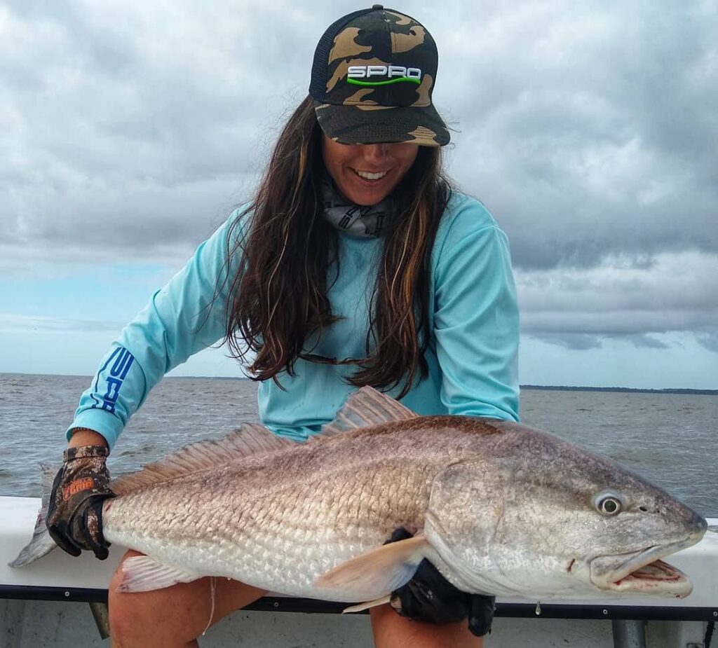 Angler holding a large redfish